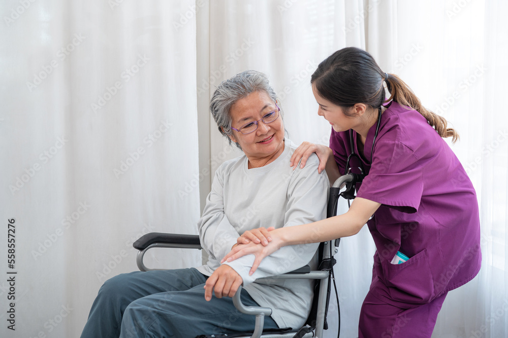 Asian young nurse taking care and talking mature female patient sitting on wheelchair in hospital. Healthcare concept, Banner cover design. Asian young nurse taking care and talking mature female patient sitting on wheelchair in hospital. Healthcare concept, Banner cover design.