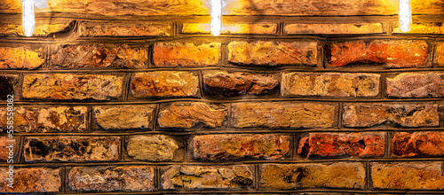 A brick wall  made of treated  antique-styled brick.