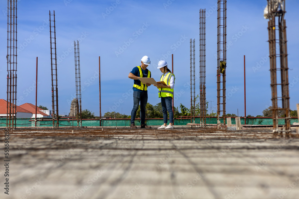 Team of engineering architect inspector and contractor having discussion while examining the quality of construction work of real estate development project concept Team of engineering architect inspector and contractor having discussion while examining the quality of construction work of real estate development project concept
