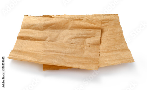 Baking paper isolated. Crumpled pieces of brown parchment or baking paper on white background. Design element.