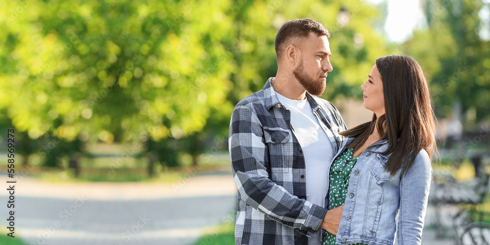 Fototapeta premium Happy couple walking in park on spring day