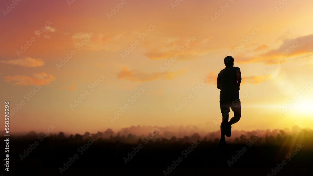 Silhouette of person running on road. Fitness runner outdoor with sunset background.