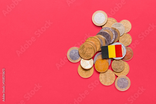 National Belgium flag and coins on red background