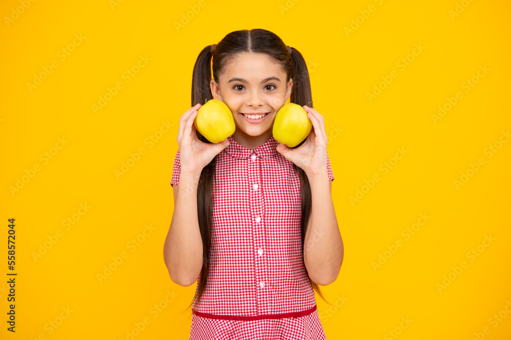 Teenager child girl biting tasty green apple. Happy teenager, positive and smiling emotions of teen girl. Teenager child girl biting tasty green apple. Happy teenager, positive and smiling emotions of teen girl.