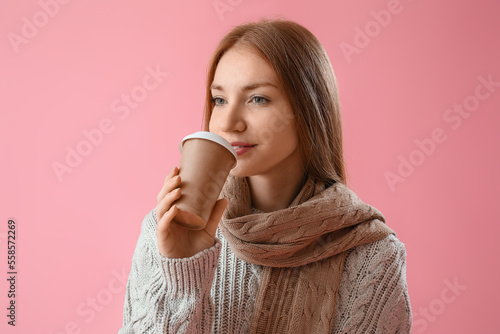 Young redhead woman in warm...