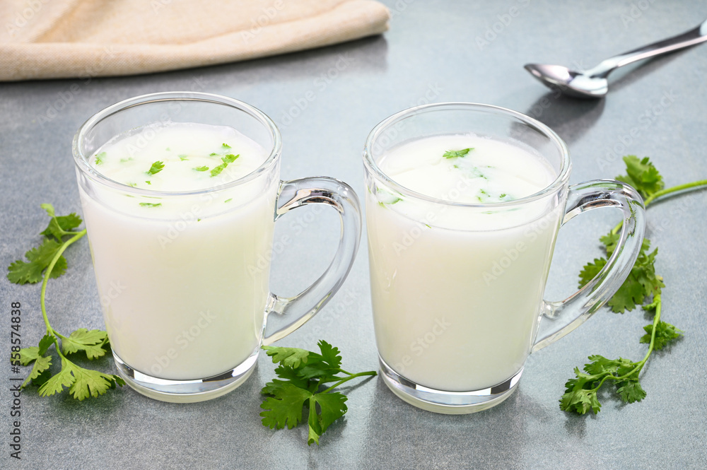 Buttermilk drink served in glass cups. Buttermilk drink served in glass cups.