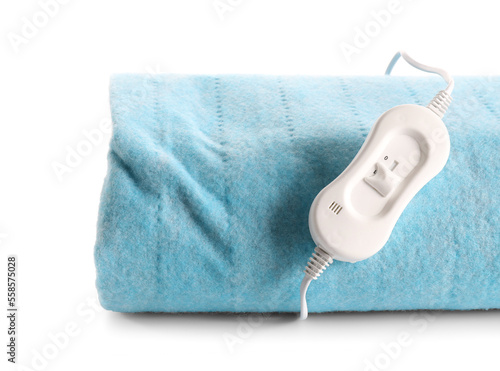 Blue electric heating pad with controller on white background, closeup
