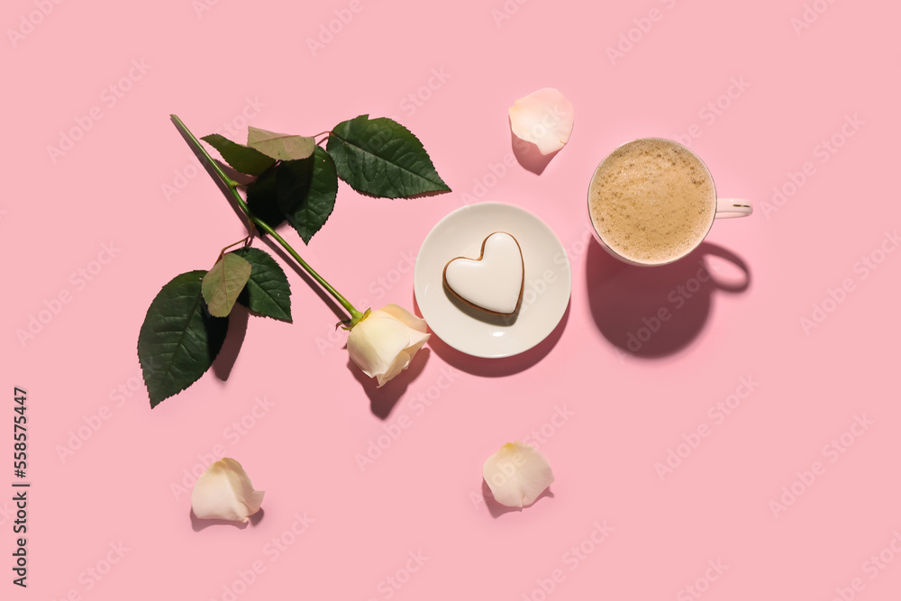 Obraz premium Cup of latte with cookie and rose on pink background. Valentine's Day celebration