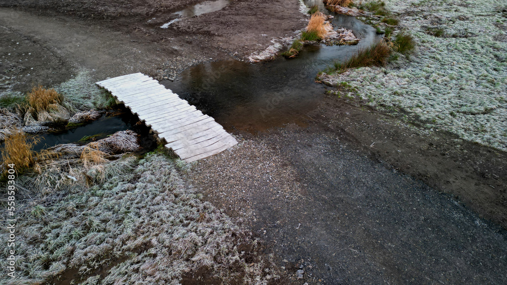 floating walkway made of wooden planks, pier, narrow curved paths on ...
