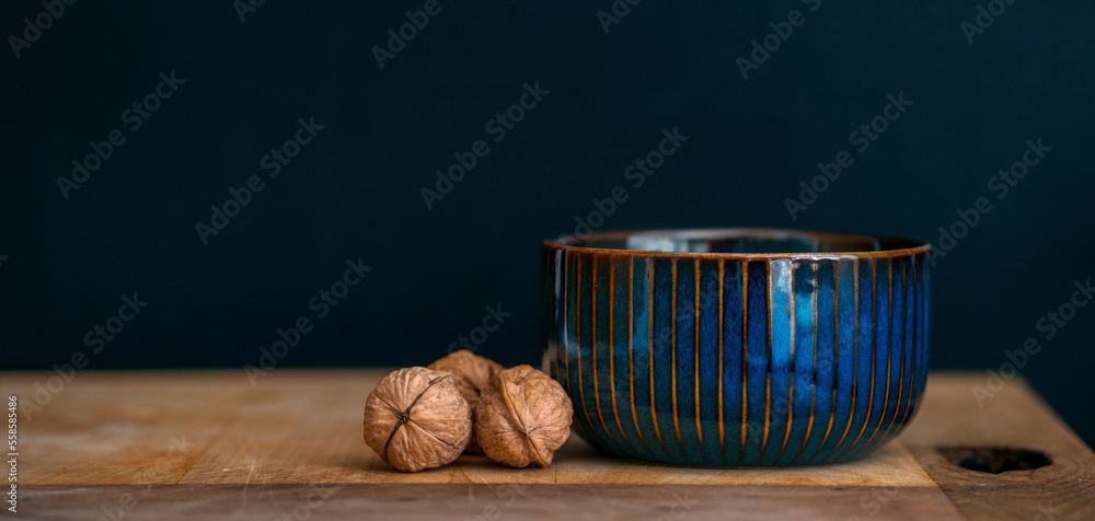 Nuts and pot with black background