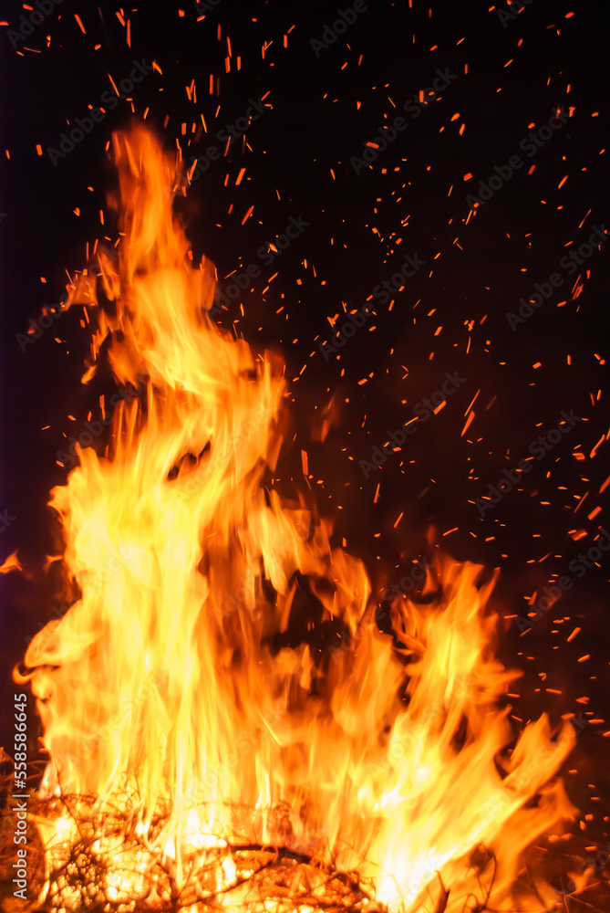 Abstract blaze fire flame texture for banner background. Fire sparks particles with flames isolated on black background. Beautiful flames. Fuel, power and energy