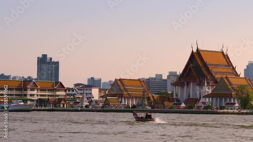 Bangkok, Thailand. December 29, 2022. Wat Kalayanamit Woramahawihan, Zoom out of  riverside temple in Bangkok. photo