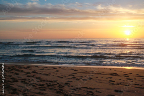 Beautiful sunset at the beach in portugal at the atlantic ocean close to lissabon. Wallpaper surf