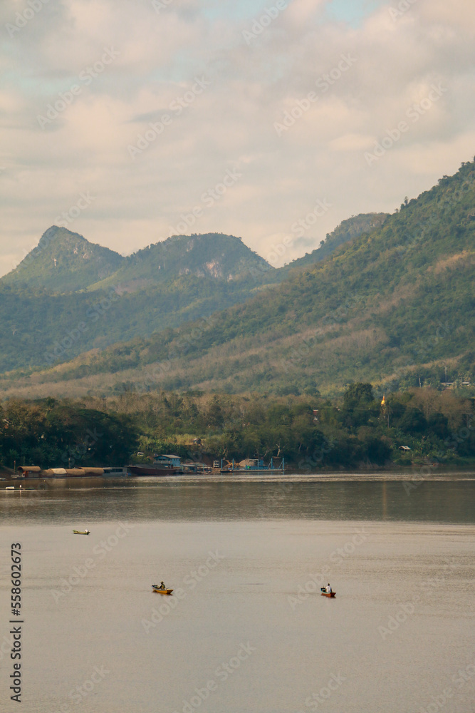Beautiful wallpaper mekong river in Laos and Thailand. Roundtrip Asia. In the background the nature of Luang Prabang