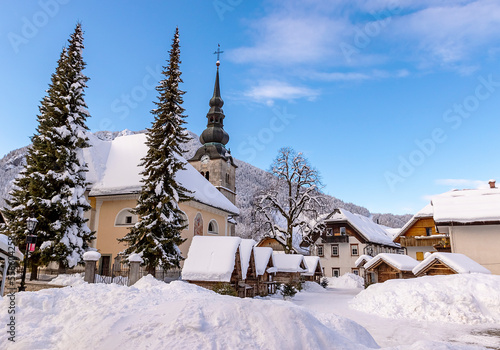 Winter landscape of Kranjska Gora village center with church  Christmas market