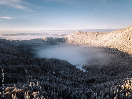 Aerial view of a foggy crat...