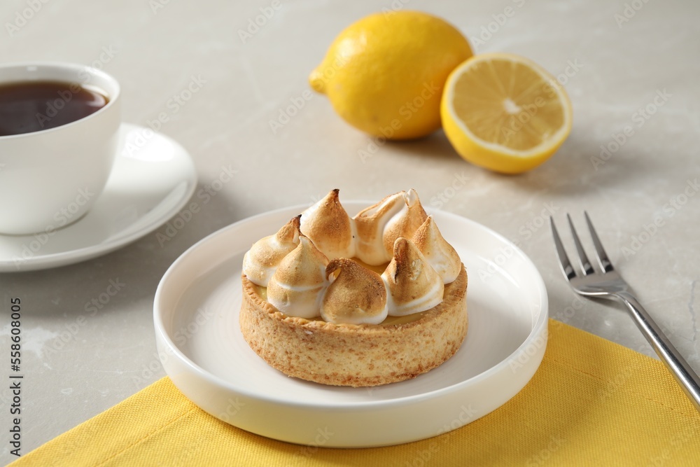 Delicious lemon meringue pie served on white table Delicious lemon meringue pie served on white table
