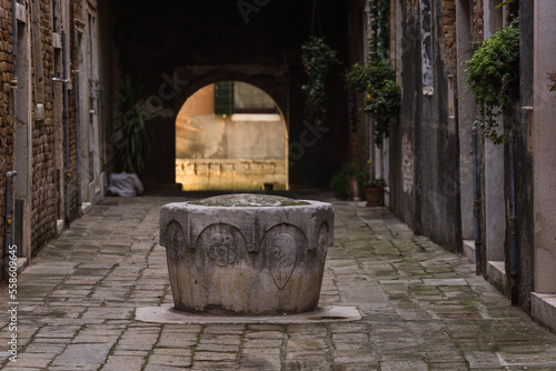 Old water well in Venice, Italy photo