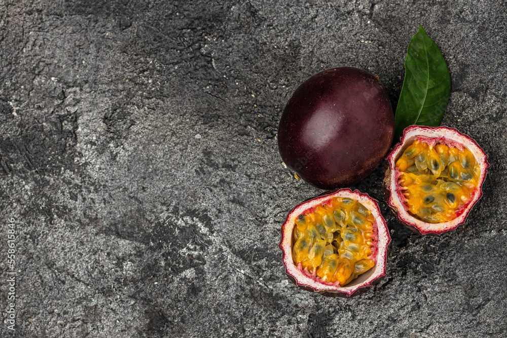 Fotografie Passion fruits on dark background