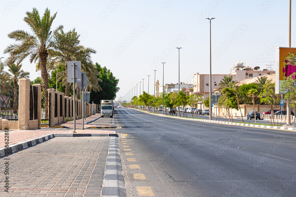 the empty road going through city
