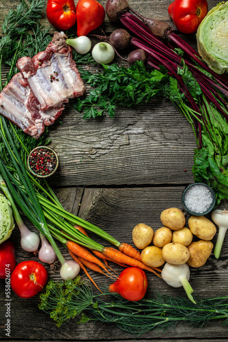 Ingredients for soup. vegetables for cooking borsch beetroot, cabbage, carrots, potatoes, tomatoes. Ukrainian cuisine concept. vertical image. top view. place for text