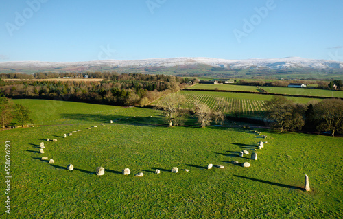 Obraz na płótnie Long Meg and Her Daughters stone circle. Prehistoric Neolithic monument. Langwathby, Cumbria, UK. S.E. over Eden Valley to snow covered Pennines w salonie