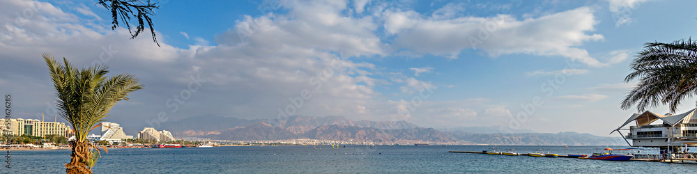 Panorama of central public beach in Eilat - famous tourist resort and recreational city located on the Red Sea, Israel

