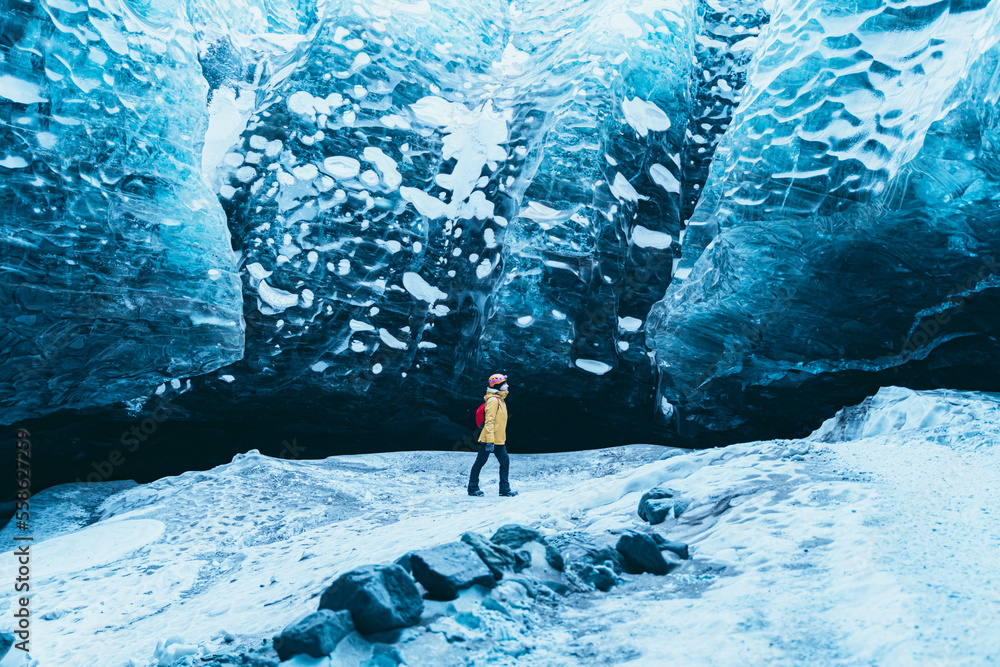 Man photographing a glacier with his smartphone.