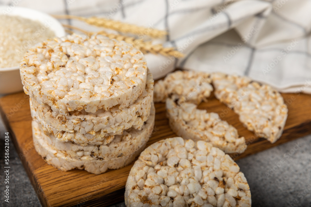 puffed rice bread on black texture background. Healthy crunchy snack. Whole grain crispy bread. Healthy food. Diet. Copy space. Place for text. puffed rice bread on black texture background. Healthy crunchy snack. Whole grain crispy bread. Healthy food. Diet. Copy space. Place for text.