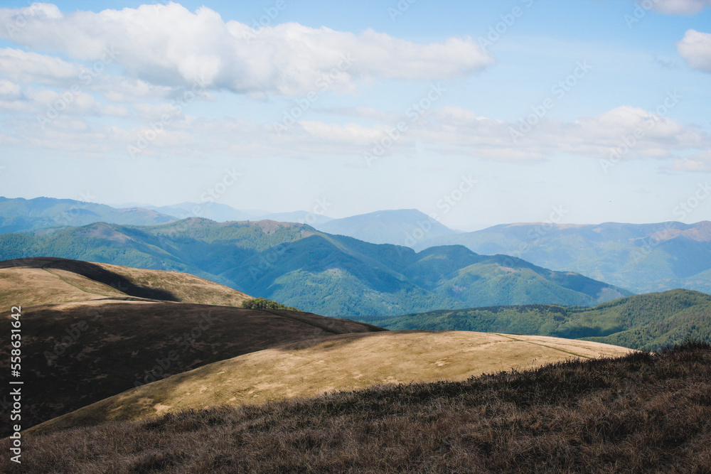 Hiking in the Carpathian Mountains. Sunny summer day. Mountain panoramas. Hiking in the Carpathian Mountains. Sunny summer day. Mountain panoramas.