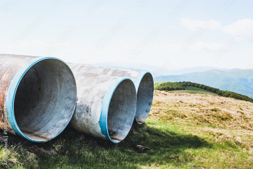 Hiking in the Carpathian Mountains. Pipes in the mountains. Sunny summer day. Hiking in the Carpathian Mountains. Pipes in the mountains. Sunny summer day.