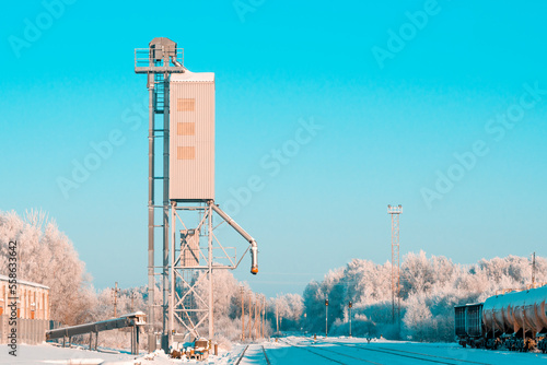 Grain elevator next to railroad during winter season