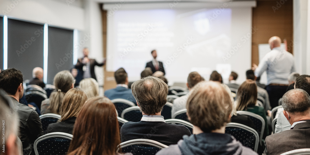 I have a question. Group of business people sitting at the chairs in conference hall. Businessman standing up asking a question. Conference and Presentation. Business and Entrepreneurship. I have a question. Group of business people sitting at the chairs in conference hall. Businessman standing up asking a question. Conference and Presentation. Business and Entrepreneurship.