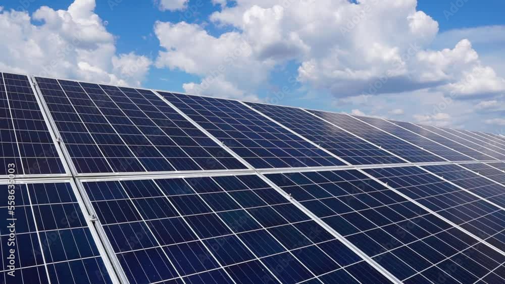 Installation in two rows of blue solar panels fixed at an angle. Photovoltaic cells for the production of renewable electricity. Solar power plant in the field. Installation in two rows of blue solar panels fixed at an angle. Photovoltaic cells for the production of renewable electricity. Solar power plant in the field.