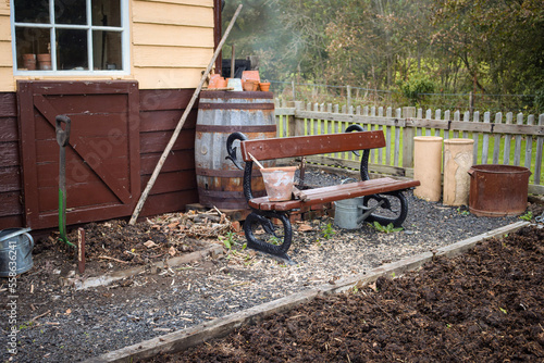 Wallpaper Mural An old cast iron and wood bench seat on an allotment vegetable plot. Torontodigital.ca
