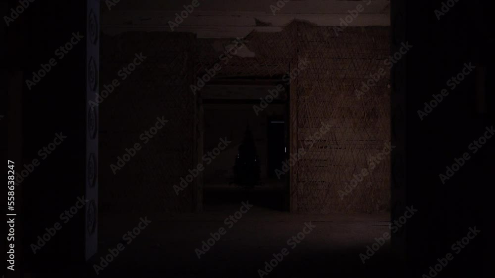 Kharkiv, Ukraine - December 2022: Christmas tree in the destroyed building of the regional council of the Kharkiv region. Kharkiv, Ukraine - December 2022: Christmas tree in the destroyed building of the regional council of the Kharkiv region.