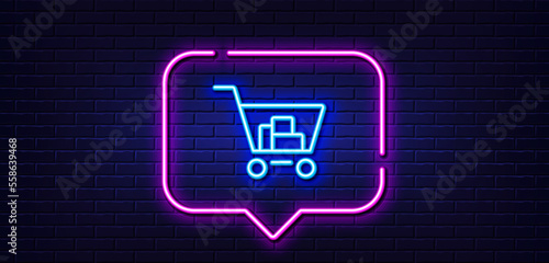 Neon light speech bubble. Shopping cart line icon. Online buying sign. Supermarket basket symbol. Neon light background. Internet shopping glow line. Brick wall banner. Vector
