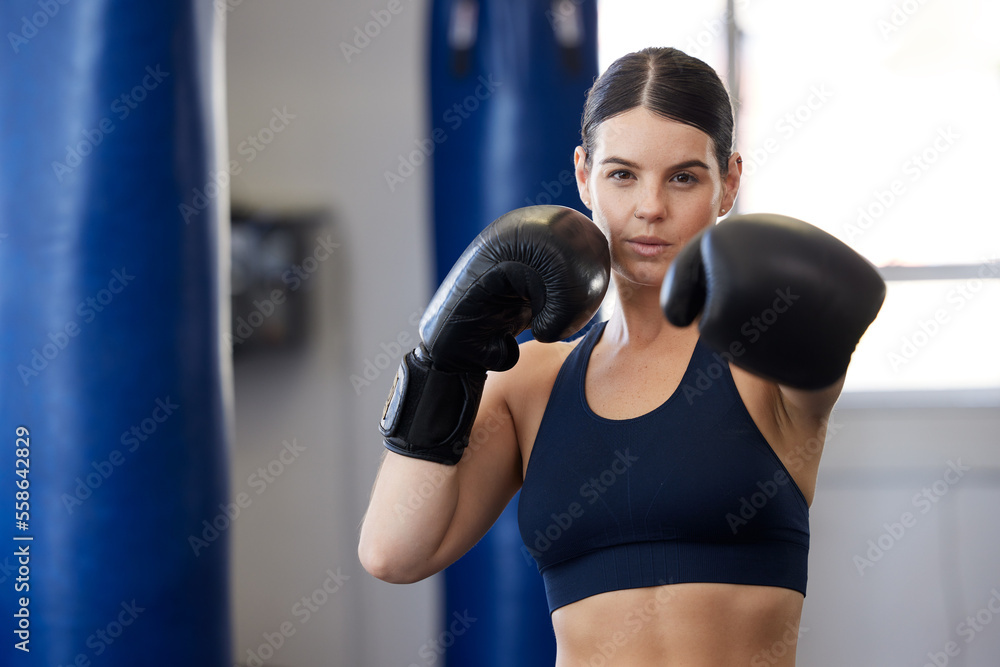 Fitness, kickboxing and portrait of woman athlete doing a cardio workout while training for a match. Sports, exercise and female boxer getting ready for a fight in sport, wellness and health gym.