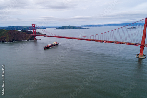 Golden Gate Bridge in San Francisco, California. Container Ship in Background