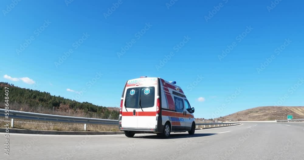 Ambulance van rushes down the highway Ambulance van rushes down the highway
