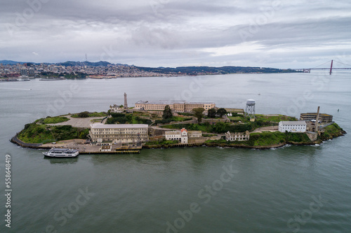 Aerial view of Alcatraz island in the San Francisco Bay. USA. The most famous Alcatraz Prison, Jail. Sightseeing Place. San Francisco Cityscape in Background. Drone