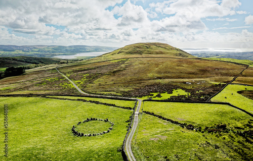 Swinside stone circle aka Sunkenkirk. Near Broughton in Furness, Cumbria. Neolithic. S.E. over Knott Hill to the Duddon estuary and Irish Sea coast photo