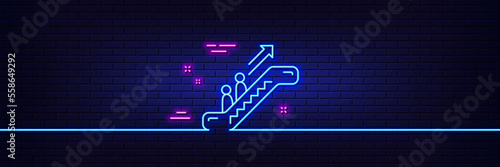 Neon light glow effect. Escalator line icon. Elevator sign. Shopping stairway symbol. 3d line neon glow icon. Brick wall banner. Escalator outline. Vector