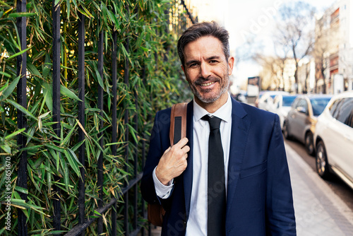 Wallpaper Mural Friendly male entrepreneur near fence Torontodigital.ca