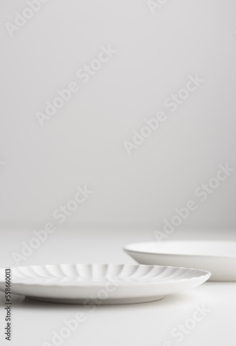 White clean empty tableware: plates on white background for a dessert