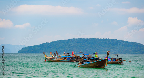 Long tail boats at Railay beach  Krabi  Thailand. Tropical paradise  turquoise water and white sand.