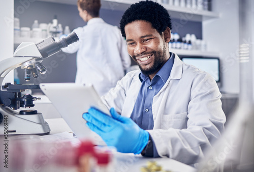 Scientist, research and black man with tablet, laboratory and innovation for healthcare, online schedule or tech. African American male, researcher and digital planning for medical diagnosis and cure