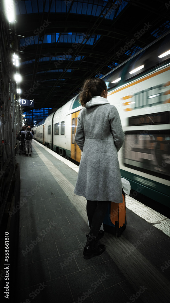 A woman waiting at the trainstation