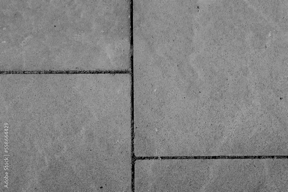 Fototapeta premium gray stone slabs with joints as flooring