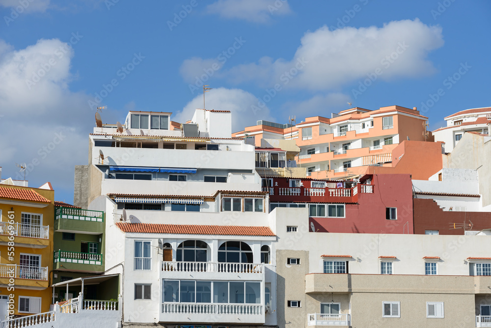 Closeup residential buildings on Sirena street, Puerto de Santiago, Tenerife. Closeup residential buildings on Sirena street, Puerto de Santiago, Tenerife.
